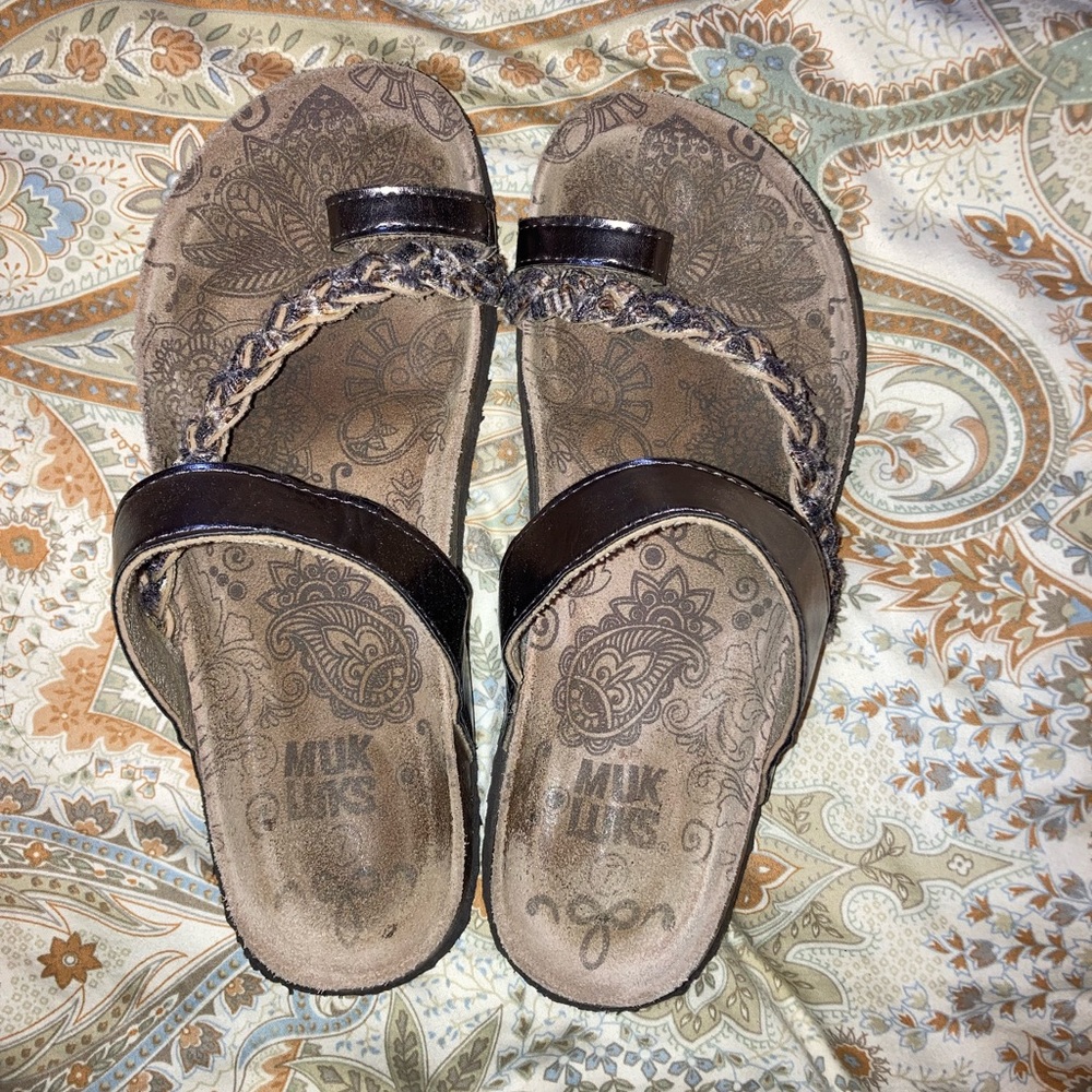 Muk luk sandals.